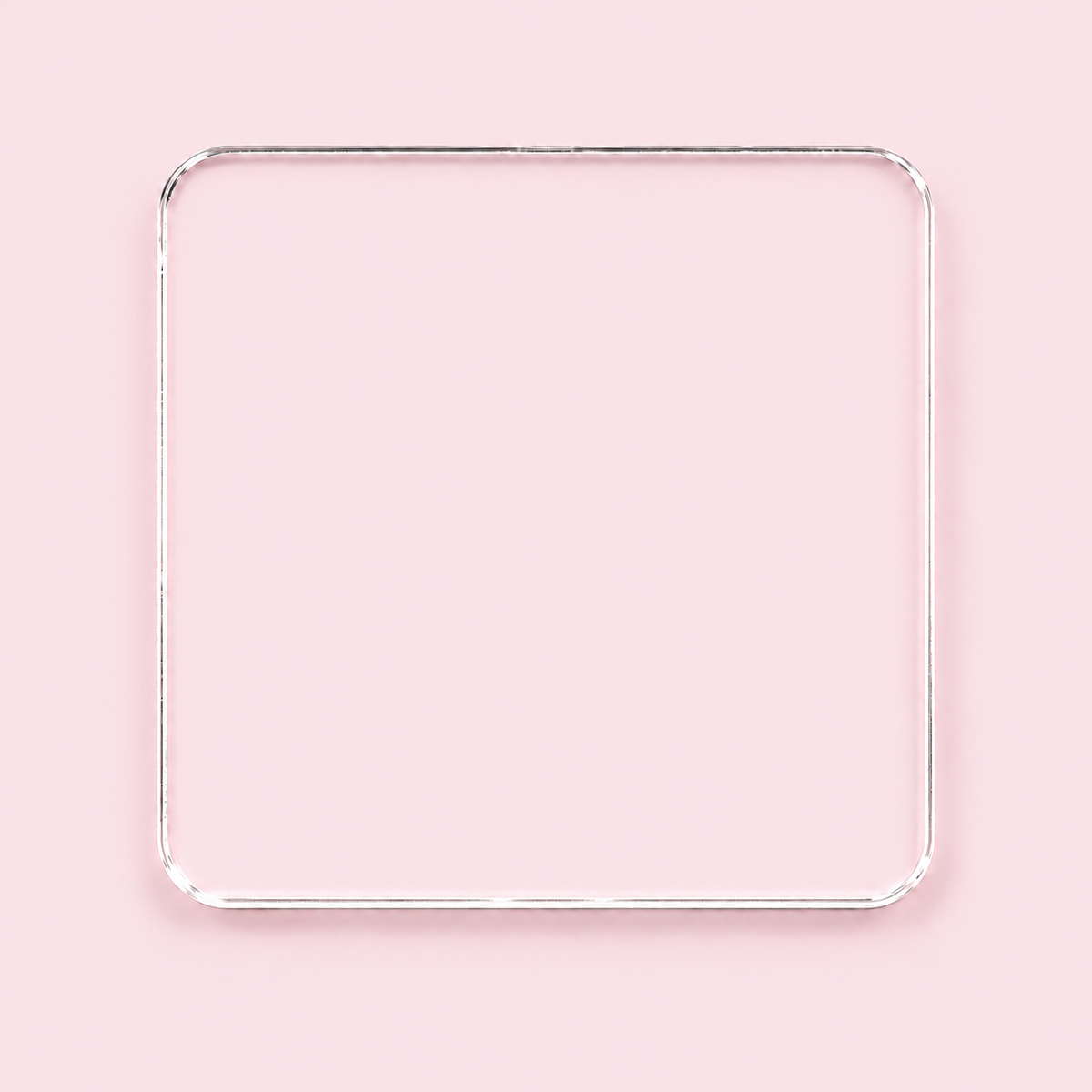 Clear rounded square acrylic blank with no hole, shown on a blush pink background.
