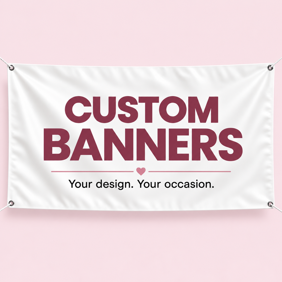 Custom banner mockup with corner grommets and the words Custom Banners, Your design. Your occasion., on a blush pink background.